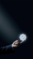 Businessman hand holding glowing compass icon on dark background representing navigation, direction and business guidance concepts.