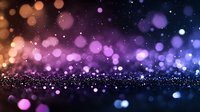 Magical glowing bokeh lights on dark background with purple and orange gradient colors creating dreamy atmospheric effect for festive designs.