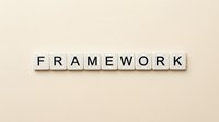 Wooden letter tiles spelling FRAMEWORK on beige background for business strategy and organizational structure concepts.
