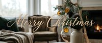 Merry Christmas greeting card with cozy living room, fireplace, pine branches in vase, dried oranges, pinecones, warm holiday decor.
