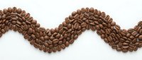 Roasted coffee beans arranged in wavy decorative border pattern on white background, isolated design element suitable for cafe branding, packaging, and beverage marketing materials.