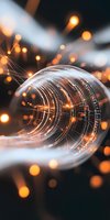 Abstract light trails captured in glass sphere with glowing orange bokeh against dark background, creating magical atmosphere for creative projects.