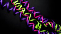 Colorful party streamers in vibrant neon colors creating festive celebration decoration on dark background for events and holidays.