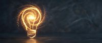 Glowing light bulb with swirling energy particles on dark wooden surface symbolizing innovation, creativity and bright ideas for business concepts.