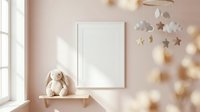 Cozy nursery room with blank white frame mockup on pastel pink wall, bunny toy on shelf, star mobile, soft natural light.