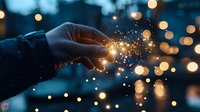 Magical glowing sparkles emanating from gentle hand gesture against dark blue bokeh background creates dreamy atmospheric mood for fantasy and wonder concepts.