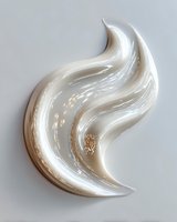 Elegant swirling cream texture with golden accents on light background, ideal for luxury cosmetic product advertising or abstract design elements.