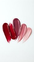 Lipstick swatches in red and pink tones on white background showing makeup color palette for beauty and cosmetic design applications.