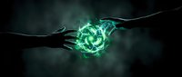 Two hands reaching toward glowing green energy sphere on dark background. Concept for power, connection, technology, innovation, and collaboration in business and science applications.