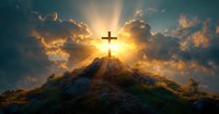 Christian cross silhouette on mountain top at dramatic sunset with sun rays breaking through clouds, spiritual religious background scene.