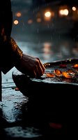 Atmospheric rainy evening scene with hands lighting candles on wet stone surface, glowing bokeh lights in background creating moody ambiance for spiritual practices.