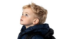 Young boy with blonde hair wearing navy blue winter jacket looking up with wonder and curiosity against white background, profile view portrait.