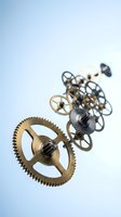 Vintage brass clockwork gears and mechanical parts floating against soft blue gradient background for steampunk design projects.