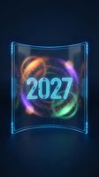Futuristic holographic display showing glowing 2027 numbers with colorful energy rings and particles on transparent glass panel against dark background.