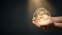 Male hands cupping glowing geometric sphere with interconnected lines representing network connections, technology innovation and digital transformation.