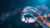 Glowing optical fiber strands curve gracefully against dark blue background with bokeh lights, showcasing modern digital connectivity and data transfer technology.