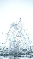 Dynamic water splash frozen in motion with droplets and streams dispersing against white background, suitable for beverage, wellness, and liquid product marketing campaigns.