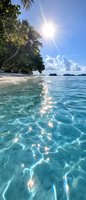 Sunlight sparkles on crystal clear turquoise water at tropical beach with palm trees and white sand. Tranquil ocean scene with distant islands and fluffy clouds.