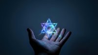 Hand holding glowing neon star of David symbol against dark blue background, representing spirituality, faith, religion, and mystical energy for design and creative projects.