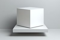 White cube on square platform against gray background, minimalist geometric composition for product display and mockup presentations on isolated surface.