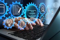 Business professional using laptop with digital automation gears and data management icons for workflow optimization and technology integration.
