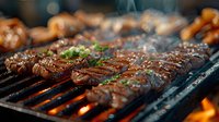 Juicy marinated beef steaks grilling on barbecue with flames and smoke, garnished with fresh herbs and sesame seeds, close-up view of meat cooking outdoors.