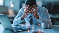 African American businessman experiencing stress at workplace with digital network overlay, highlighting modern workplace pressure and burnout in corporate environment.