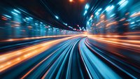 Abstract motion blur of light trails in underground tunnel, dynamic blue and orange streaks creating futuristic speed effect for technology and transit concepts.