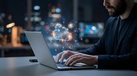 Professional man working on laptop with digital cloud computing icons and data transfer symbols floating above keyboard in modern office environment at night.