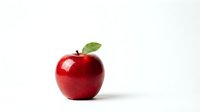Fresh red apple with green leaf isolated on white background for healthy eating and nutrition concepts.