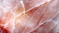 Luxurious pink and coral marble texture with natural veining and cracks creates elegant stone surface pattern for interior design and luxury backgrounds.