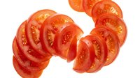Fresh ripe tomato slices arranged on white background, ideal for food, cooking, recipe, nutrition, and culinary design projects.
