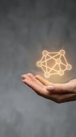 Hand holding glowing network connection symbol representing digital connectivity, teamwork and business collaboration concepts.