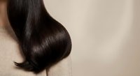 Luxurious dark brown hair with glossy shine and smooth texture showcasing healthy hair care and professional salon styling results for beauty treatments.