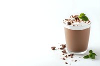 Creamy chocolate milkshake topped with whipped cream, chocolate shavings and fresh mint leaves on white background. Refreshing cold beverage.
