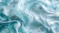 Swirling turquoise and white liquid abstract background with dynamic fluid motion and bubble formations creates mesmerizing marble-like pattern for luxury designs.