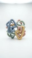 Pastel colored abstract geometric shapes interlocking in soft blue, pink, yellow, and green tones on isolated white background, suitable for modern design projects.