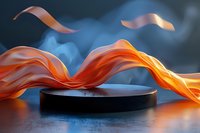 Black cylindrical podium with flowing orange silk ribbons against blue smoky background for luxury product display and premium brand presentation.