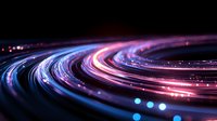 Glowing curved light trails in motion creating dynamic swirls of blue, pink and purple neon colors against dark background, abstract long exposure photography effect.