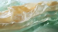 Ocean waves with foam and spray in soft green and beige tones creating dynamic seascape motion for coastal and marine themed designs.