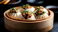 Steamed dumplings with spicy meat filling and green onions in traditional bamboo steamer, dark moody background with dramatic lighting. Asian cuisine.