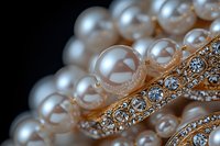 Elegant pearl necklace with crystal embellished gold setting against dark background, macro photography showcasing luxury jewelry details and craftsmanship.