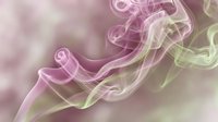 Soft pink and green smoke swirls gracefully against a blurred pastel background, creating an ethereal, dreamy atmosphere.