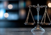 Symbol of justice scales on dark background with bokeh lights, representing law, legal system and judicial balance in modern setting.