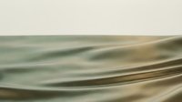 Smooth flowing fabric waves in soft sage green and neutral tones, creating an elegant abstract background for design, textile, and luxury branding projects.