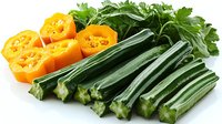 Fresh cut yellow mini sweet peppers and green celery stalks with parsley leaves arranged on white background, healthy raw vegetables for cooking and salads.