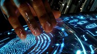 Futuristic biometric fingerprint scanner with glowing blue interface and digital security elements for cybersecurity and identity verification technology.