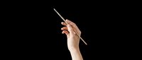 Hand holding a thin paintbrush isolated on transparent background, ready for art, craft, and creative design projects including stickers, clipart, and print on demand.