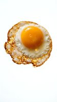 Golden fried egg with crispy edges isolated on white background for breakfast menu design and culinary projects.