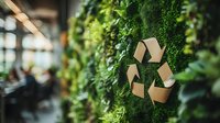 Recycling symbol on green living wall with lush foliage in modern eco-friendly office interior, highlighting environmental sustainability and corporate responsibility.